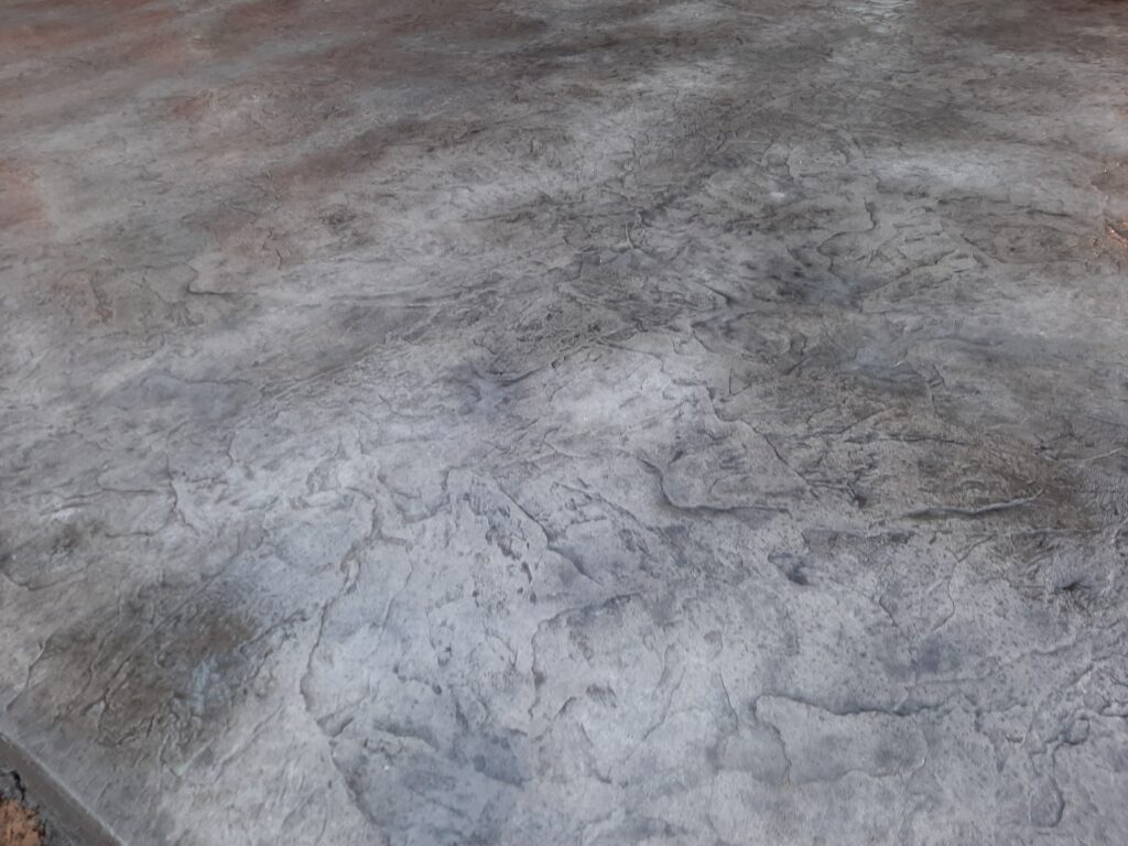 Skin stamp with antiquing agent to bring out definition
