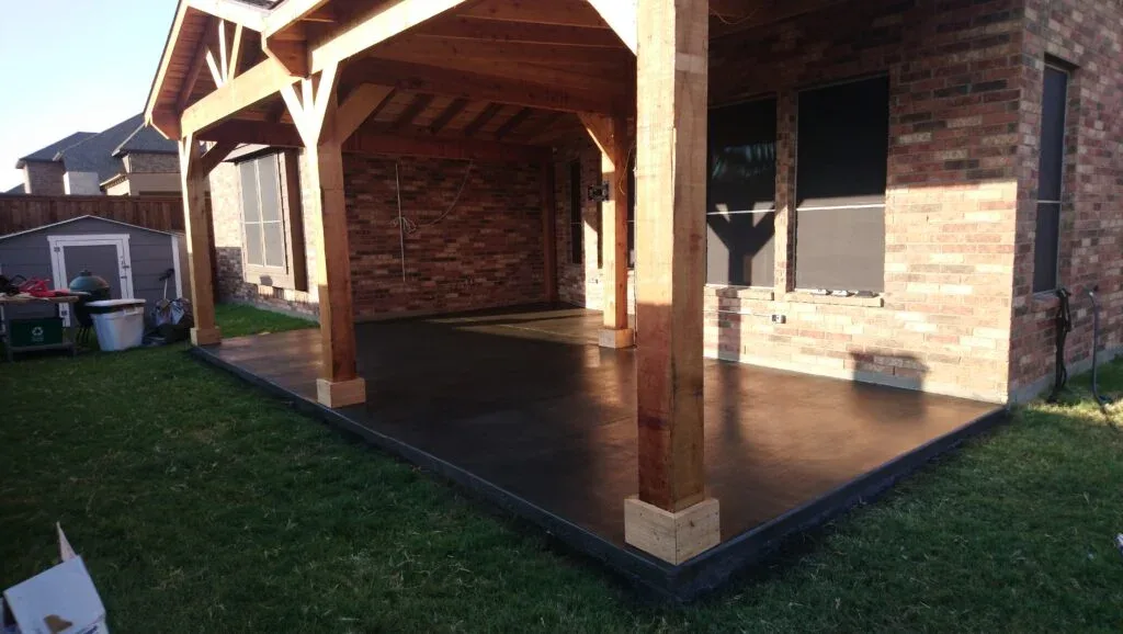 Custom concrete patio installation Fort Worth backyard design