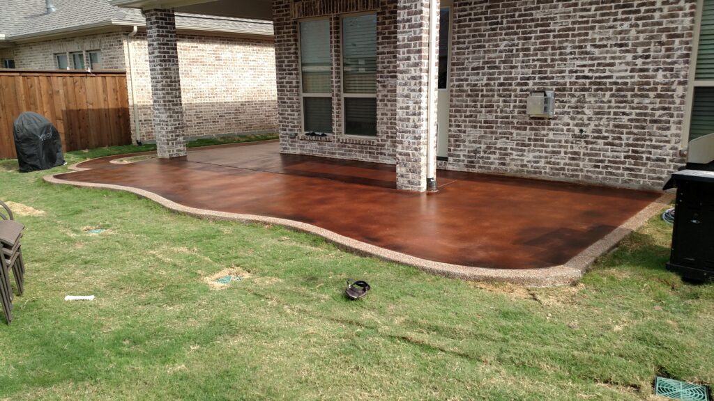 Adobe stain with Bark Brown highlights. Exposed aggregate trim