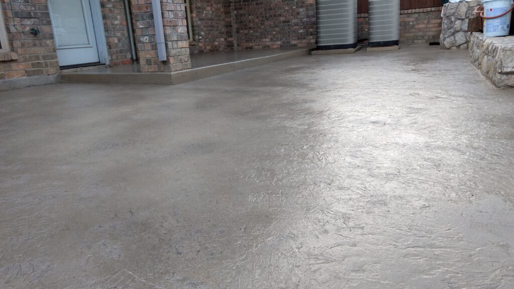 Skin stamped patio with a gray integral color